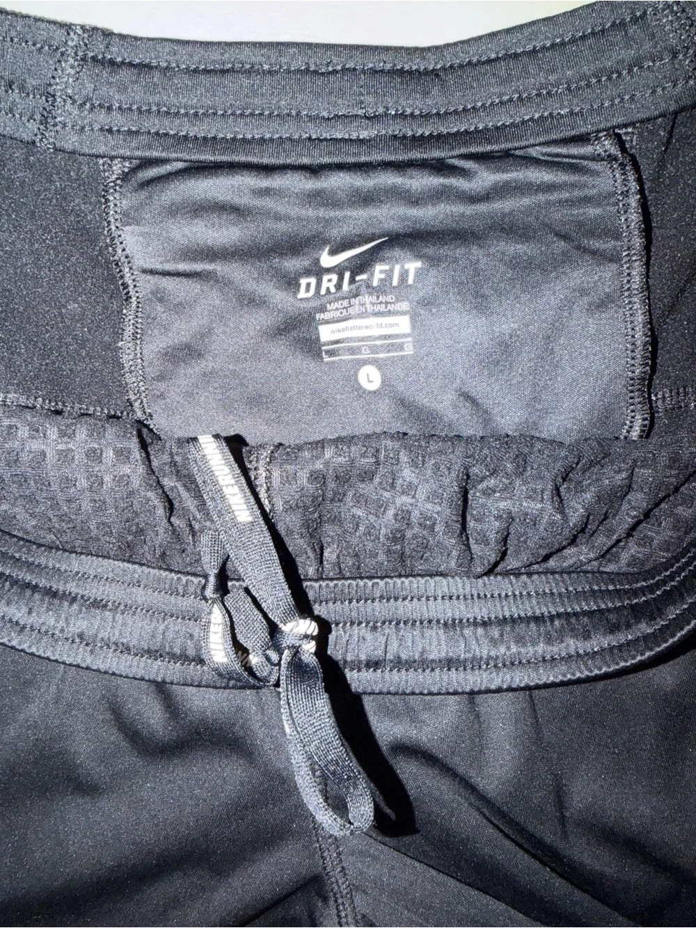Nike Black Track Pants with White Swoosh and Reflective Details